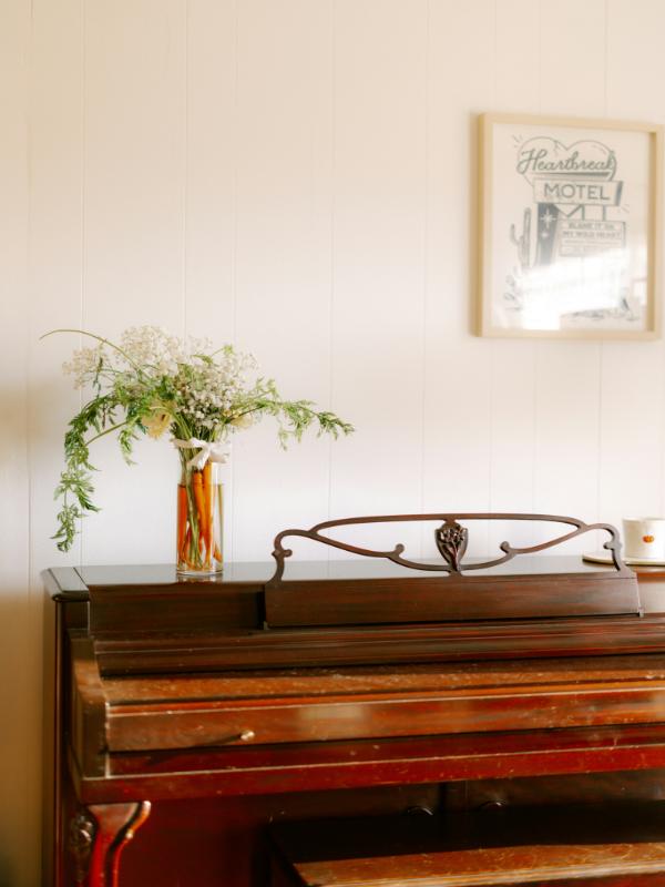 brown-vintage-piano-with-plant